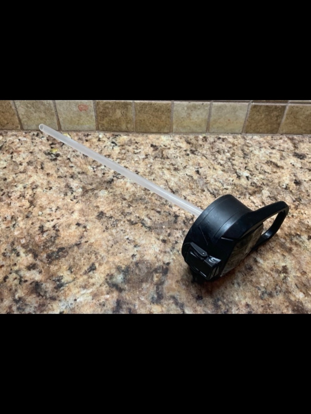 Simple Modern Summit bottle flip lid with a silicone straw.